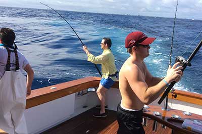 Dueling fisherman aboard the Reel Janie